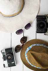 Image showing Beach accessories on wooden board