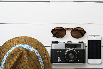 Image showing Beach accessories on wooden board