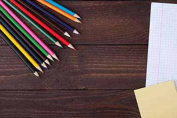 Image showing School supplies on a wooden table