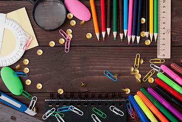 Image showing School supplies on a wooden table