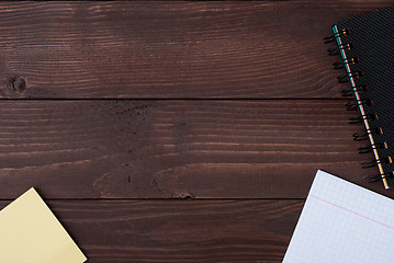 Image showing School supplies on a wooden table