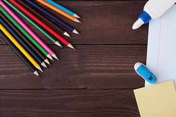 Image showing School supplies on a wooden table