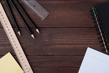 Image showing School supplies on a wooden table