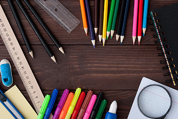 Image showing School supplies on a wooden table