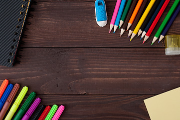 Image showing School supplies on a wooden table