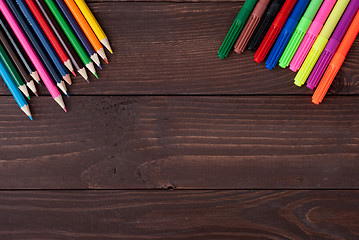 Image showing Colored pencils on a wooden board