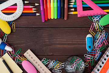 Image showing School supplies on a wooden table