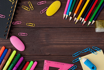 Image showing School supplies on a wooden table