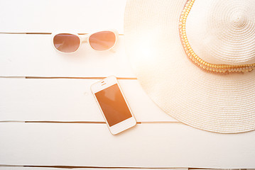 Image showing Beach accessories on wooden board