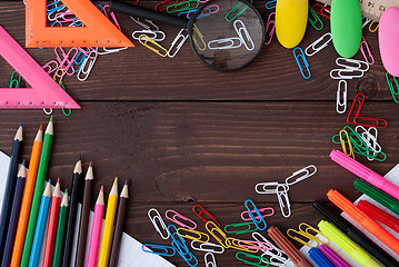 Image showing School supplies on a wooden table