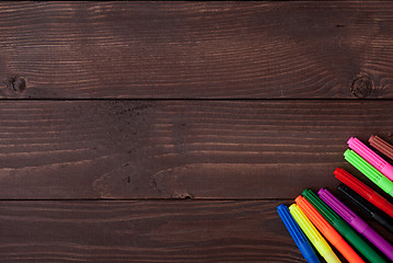 Image showing Colored pencils on a wooden board