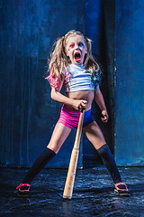 Image showing Little girl pointing in toy gun