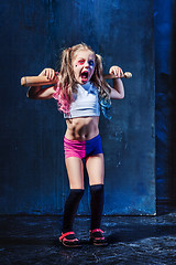 Image showing Little girl pointing in toy gun