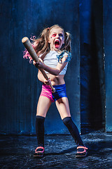 Image showing Little girl pointing in toy gun