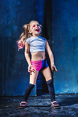 Image showing The funny crasy girl on dark background