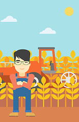 Image showing Man standing with combine on background.