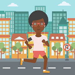 Image showing Woman running with earphones and smartphone.