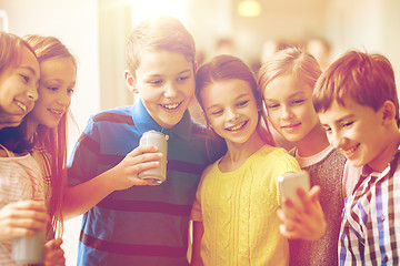 Image showing group of school kids with smartphone and soda cans
