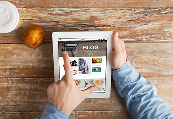 Image showing close up of hands with internet blog on tablet pc