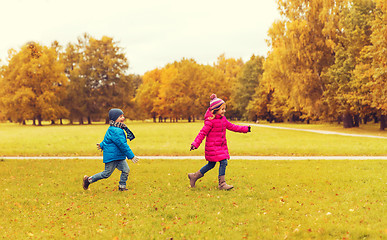 Image showing group of happy little kids running outdoors