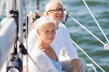 Image showing senior couple hugging on sail boat or yacht in sea