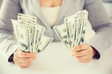 Image showing close up of woman hands holding us dollar money