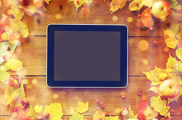 Image showing tablet pc with autumn leaves, fruits and berries