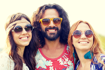 Image showing smiling young hippie friends outdoors