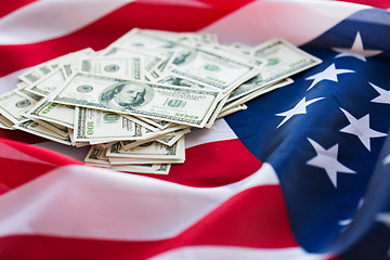 Image showing close up of american flag and dollar cash money