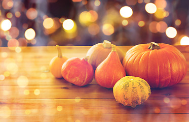 Image showing close up of halloween pumpkins on wooden table