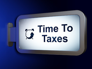 Image showing Time concept: Time To Taxes and Alarm Clock on billboard background