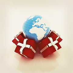 Image showing Traditional Christmas gifts and earth. Global holiday concept . 