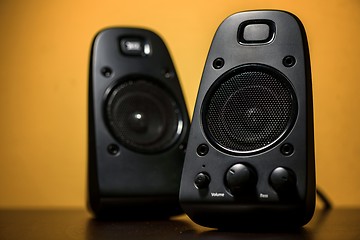 Image showing Audio speakers on yellow background