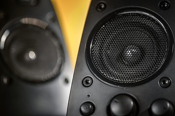 Image showing Audio speakers on yellow background