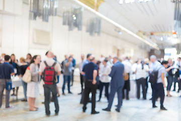 Image showing Abstract blurred people socializing during coffee break at business conference.