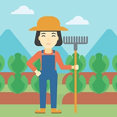 Image showing Female farmer with rake vector illustration.