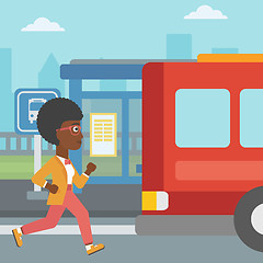 Image showing Latecomer woman running for the bus.