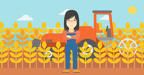 Image showing Woman standing with combine on background.