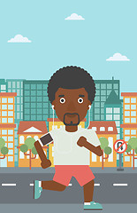 Image showing Man running with earphones and smartphone.