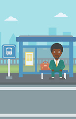 Image showing Man waiting for bus at the bus stop.