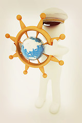 Image showing Sailor with wood steering wheel and earth. Trip around the world