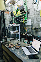 Image showing View of old tools,laptop and phone on table