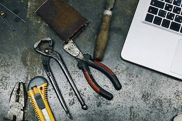 Image showing Top view of old tools,laptop and phone on table