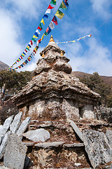 Image showing Buddhism stupa or chorten with prayer flags in Himalayas
