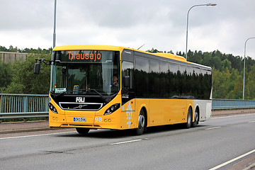 Image showing Yellow Volvo 8900 Bus in Urban Environment