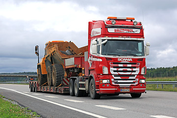 Image showing Red Scania R620 V8 Hauls Mining Equipment on Freeway