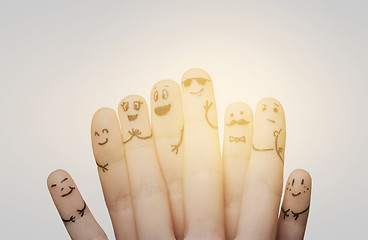 Image showing close up of hands and fingers with smiley faces