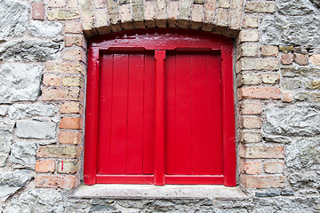 Image showing close up of vintage window in old stone wall