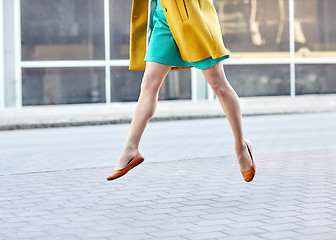 Image showing young woman or teenage girl legs on city street