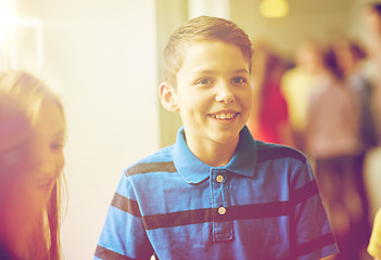 Image showing group of smiling school kids in corridor